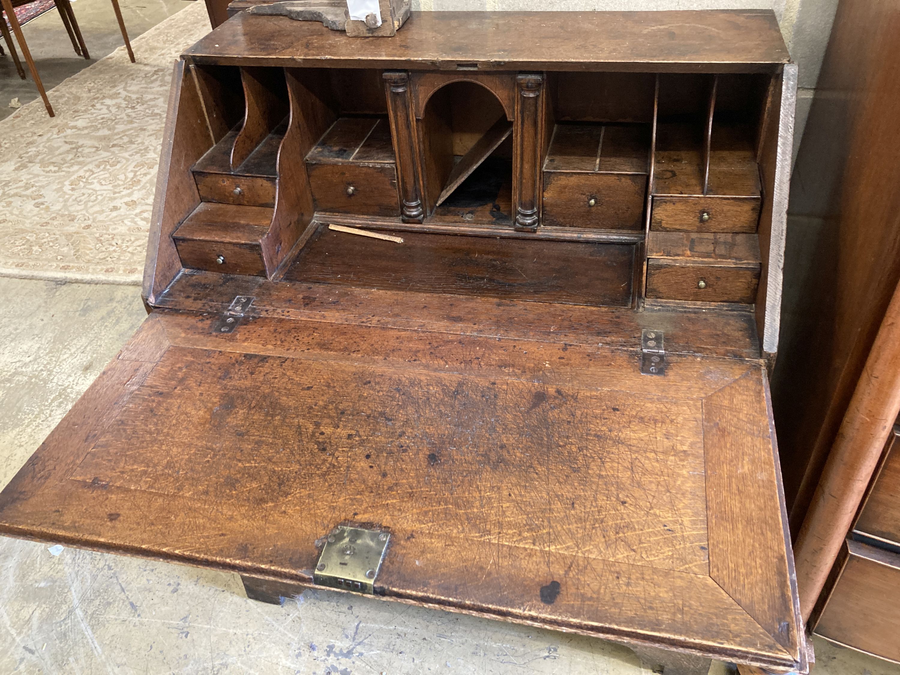 A George II oak bureau, width 89cm, depth 52cm, height 104cm
